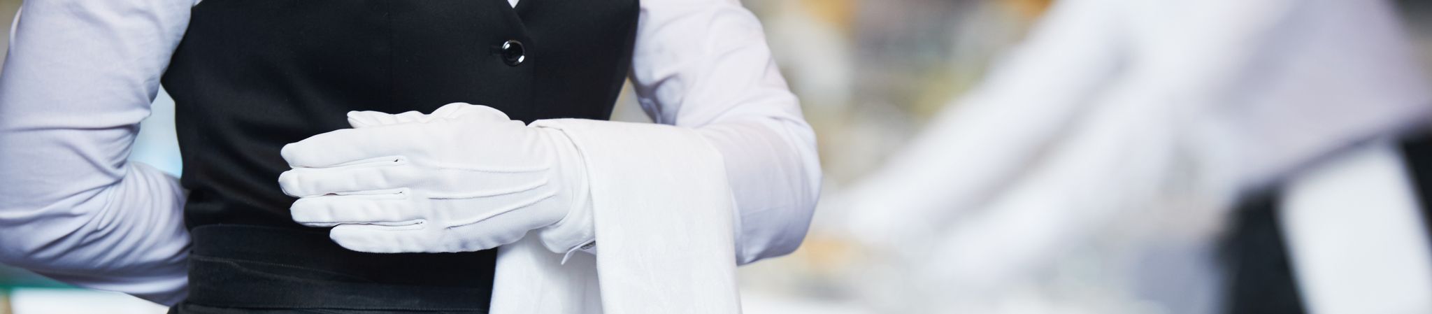 catering staff with a towel over their arm